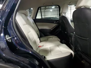 2016 Mazda CX-5 Grand Touring with VIN JM3KE4DY0G0826687, listed as a Copart auction lot 50886975 with 130,493 mi miles and Salvage Title. Bid and sale history available at carsss.com. Image 12.
