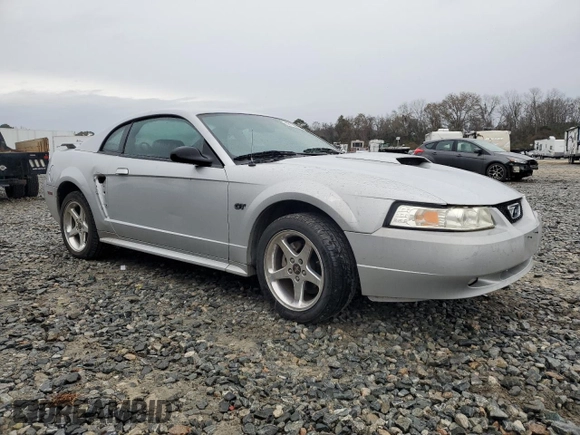 2003 Ford Mustang GT Deluxe with VIN 1FAFP42X33F380899, listed as a Copart auction lot 42158555 with 142,086 mi miles and Salvage Title. Bid and sale history available at carsss.com. Image 4.