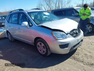 2009 Kia Rondo LX with VIN KNAFG528697273077, listed as a IAAI auction lot 41814759 with 104,699 mi miles. Bid and sale history available at carsss.com. Image 1.