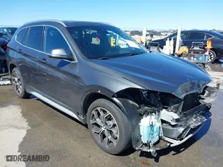 2020 BMW X1 sDrive28i with VIN WBXJG7C0XL3L92799, listed as a IAAI auction lot 41752133 with 92,328 mi miles. Bid and sale history available at carsss.com. Image 1.