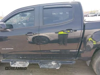2021 Chevrolet Colorado 4WD Z71 z VIN 1GCGTDEN1M1256939, wystawiony jako IAAI lot #42071364 z przebiegiem 38 972 mil mil oraz . Historia ofert i sprzedaży dostępna na DreamBid. Obrazek 14.