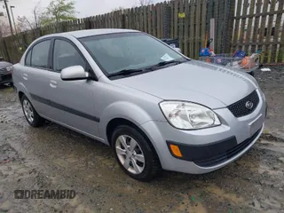 2009 Kia Rio SX with VIN KNADE223596538965, listed as a IAAI auction lot 42029409 with 143,794 mi miles. Bid and sale history available at carsss.com. Image 1.
