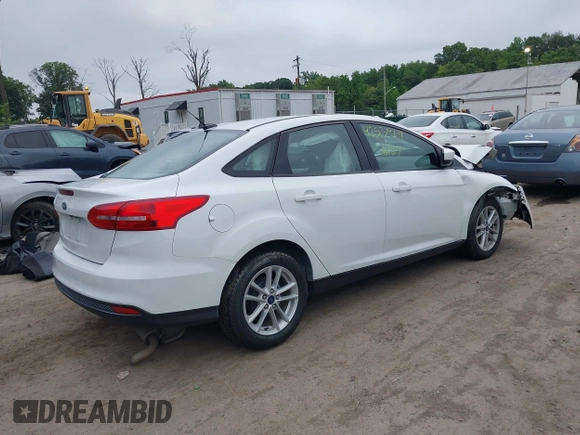 2018 Ford Focus SE z VIN 1FADP3F24JL247003, wystawiony jako IAAI lot #42531969 z przebiegiem 55 344 mil mil oraz . Historia ofert i sprzedaży dostępna na DreamBid. Obrazek 4.