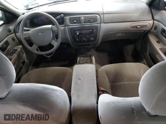 2005 Ford Taurus SE with VIN 1FAFP53215A133518, listed as a Copart auction lot 59615205 with 127,778 mi miles and Salvage title. Bid and sale history available at DreamBid. Image 8.