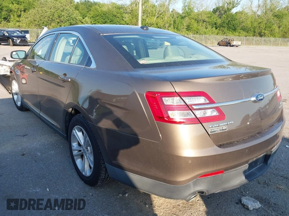 2015 Ford Taurus SEL z VIN 1FAHP2E84FG125243, wystawiony jako IAAI lot #42045847 z przebiegiem 42 093 mil mil oraz . Historia ofert i sprzedaży dostępna na DreamBid. Obrazek 3.