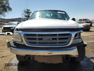 2000 Ford F-150 XL with VIN 1FTZF0727YKA84301, listed as a Copart auction lot 71593544 with 0 mi miles and Salvage Title. Bid and sale history available at carsss.com. Image 5.