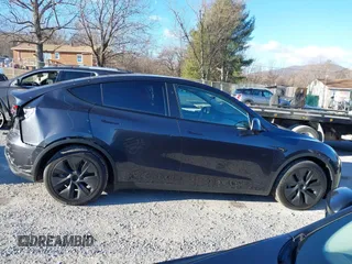 2024 Tesla Model Y Long Range with VIN 7SAYGDEE7RF199673, listed as a IAAI auction lot 41263305 with 3,137 mi miles and . Bid and sale history available at DreamBid. Image 13.