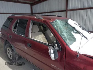 2003 Isuzu Rodeo with VIN 4S2CK58W534304195, listed as a IAAI auction lot 41354536 with Not Provided miles and . Bid and sale history available at DreamBid. Image 13.