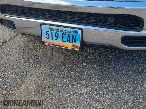 2023 Ram 1500 Big Horn with VIN 1C6RRFFG4PN561004, listed as a IAAI auction lot 42809372 with 75,509 mi miles and . Bid and sale history available at DreamBid. Image 4.