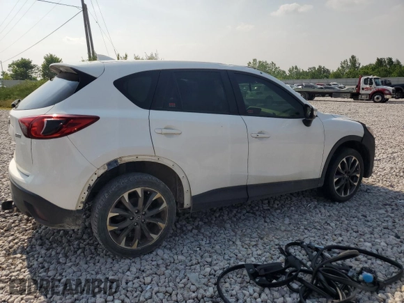 2016 Mazda CX-5 Grand Touring z VIN JM3KE4DY7G0864109, wystawiony jako Copart lot #59635865 z przebiegiem Nie podano mil oraz Czysty tytuł • Clean title. Historia ofert i sprzedaży dostępna na DreamBid. Obrazek 3.