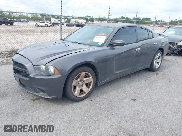2014 Dodge Charger Police z VIN 2C3CDXAT9EH191184, wystawiony jako IAAI lot #42468882 z przebiegiem 202 790 mil mil oraz . Historia ofert i sprzedaży dostępna na DreamBid. Obrazek 2.