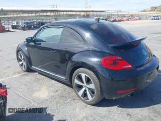 2012 Volkswagen Beetle 2.0T Turbo w/Sun/Snd/Nav PZEV with VIN 3VWVA7AT1CM654881, listed as a IAAI auction lot 41927926 with 71,357 mi miles. Bid and sale history available at carsss.com. Image 3.