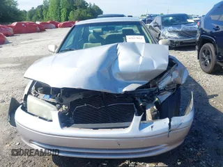 2001 Toyota Camry CE z VIN 4T1BG22K01U053432, wystawiony jako IAAI lot #42257822 z przebiegiem 128 610 mil mil oraz . Historia ofert i sprzedaży dostępna na DreamBid. Obrazek 12.