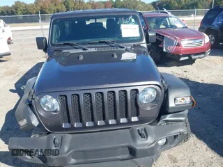 2020 Jeep Wrangler Unlimited Sport S with VIN 1C4HJXDG1LW237405, listed as a IAAI auction lot 40631451 with 60,256 mi miles and . Bid and sale history available at DreamBid. Image 12.
