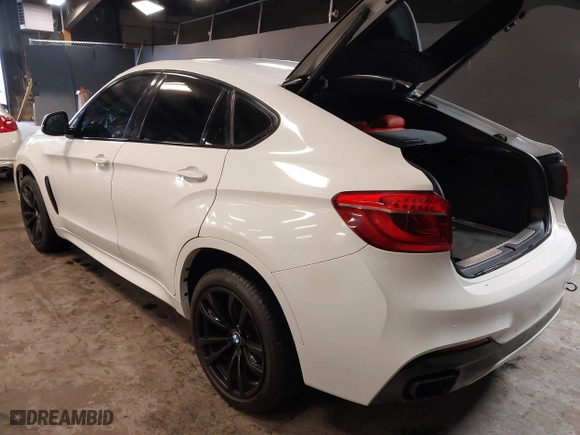2019 BMW X6 sDrive35i with VIN 5UXKU0C5XK0S97686, listed as a IAAI auction lot 40436492 with 105,584 mi miles. Bid and sale history available at carsss.com. Image 3.