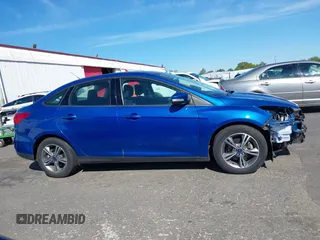 2018 Ford Focus SE z VIN 1FADP3FE4JL279265, wystawiony jako IAAI lot #42068130 z przebiegiem 43 616 mil mil oraz . Historia ofert i sprzedaży dostępna na DreamBid. Obrazek 14.
