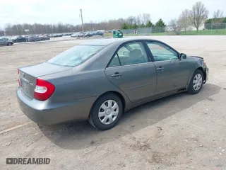 2004 Toyota Camry LE with VIN 4T1BE32K04U853924, listed as a IAAI auction lot 42114407 with 246,272 mi miles. Bid and sale history available at carsss.com. Image 4.