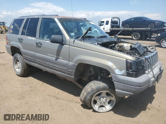 1997 Jeep Grand Cherokee Laredo z VIN 1J4GZ58S6VC636803, wystawiony jako Copart lot #59977115 z przebiegiem Nie podano mil oraz Szkoda całkowita • Salvage title. Historia ofert i sprzedaży dostępna na DreamBid. Obrazek 4.