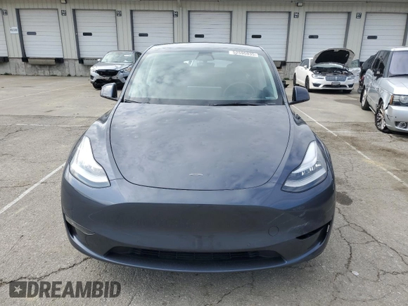 2023 Tesla Model Y Long Range with VIN 7SAYGDEE2PA024693, listed as a Copart auction lot 52595935 with 35,179 mi miles and Salvage Title. Bid and sale history available at DreamBid. Image 5.
