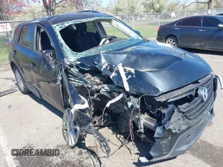 2016 Mazda CX-5 Touring z VIN JM3KE4CY5G0670888, wystawiony jako IAAI lot #42036946 z przebiegiem Nie podano mil oraz . Historia ofert i sprzedaży dostępna na DreamBid. Obrazek 1.