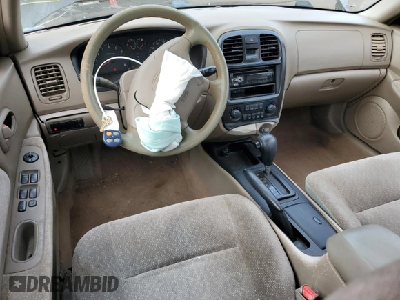 2001 Kia Optima LX z VIN KNAGD126315028712, wystawiony jako Copart lot #85302564 z przebiegiem 81 722 mil mil oraz Nie do naprawy • Non repairable. Historia ofert i sprzedaży dostępna na DreamBid. Obrazek 8.