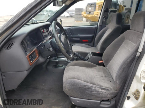 1997 Jeep Grand Cherokee Laredo with VIN 1J4GZ58SXVC597519, listed as a Copart auction lot 88437475 with 172,051 mi miles and Salvage Title. Bid and sale history available at carsss.com. Image 7.