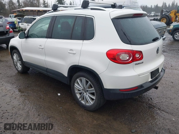 2011 Volkswagen Tiguan SE with VIN WVGBV7AXXBW546640, listed as a IAAI auction lot 41665036 with 106,071 mi miles and . Bid and sale history available at DreamBid. Image 3.