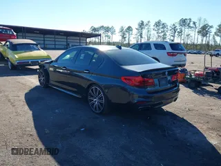2018 BMW 5 Series M550i xDrive with VIN WBAJB9C57JG463933, listed as a IAAI auction lot 41295711 with 99,173 mi miles and . Bid and sale history available at carsss.com. Image 3.