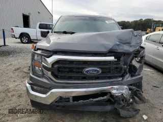 2023 Ford F-150 XL with VIN 1FTEW1EB0PKE65574, listed as a Copart auction lot 88522215 with 80,828 mi miles and Salvage Title. Bid and sale history available at carsss.com. Image 5.
