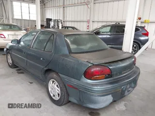 1998 Pontiac Grand Am SE with VIN 1G2NE52T1WC768383, listed as a IAAI auction lot 42220195 with 275,908 mi miles and . Bid and sale history available at DreamBid. Image 3.