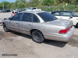 1995 Ford Crown Victoria with VIN 2FALP73W5SX140346, listed as a IAAI auction lot 41974429 with 166,540 mi miles. Bid and sale history available at carsss.com. Image 3.