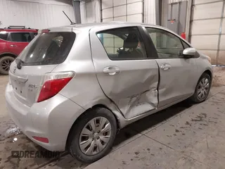 2012 Toyota Yaris L with VIN JTDKTUD34CD523773, listed as a IAAI auction lot 41616220 with 77,332 mi miles. Bid and sale history available at carsss.com. Image 4.