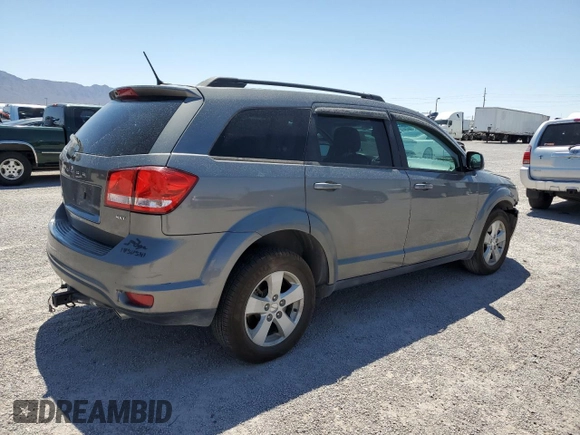 2012 Dodge Journey SXT z VIN 3C4PDDBG0CT345864, wystawiony jako Copart lot #55453875 z przebiegiem 142 444 mil mil oraz Szkoda całkowita • Salvage title. Historia ofert i sprzedaży dostępna na DreamBid. Obrazek 3.