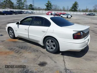 2003 Pontiac Bonneville SLE z VIN 1G2HY52K134202421, wystawiony jako IAAI lot #42136163 z przebiegiem Nie podano mil oraz . Historia ofert i sprzedaży dostępna na DreamBid. Obrazek 3.