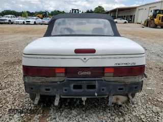 1993 Geo Metro z VIN JG1MR3362PK209644, wystawiony jako Copart lot #58749655 z przebiegiem 149 163 mil mil oraz Szkoda całkowita • Salvage title. Historia ofert i sprzedaży dostępna na DreamBid. Obrazek 6.