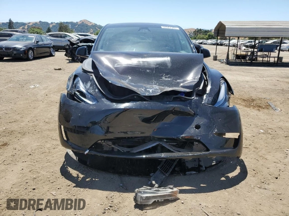 2024 Tesla Model Y Long Range with VIN 7SAYGAEE9RF125458, listed as a Copart auction lot 59567365 with 28,966 mi miles and Salvage title. Bid and sale history available at DreamBid. Image 5.