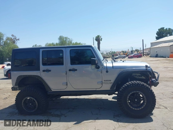 2018 Jeep Wrangler Unlimited Sport with VIN 1C4BJWDG4JL807265, listed as a IAAI auction lot 42520648 with 69,229 mi miles and . Bid and sale history available at DreamBid. Image 14.