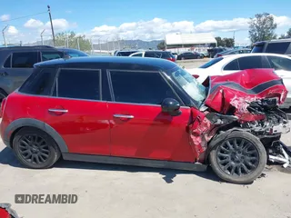 2017 MINI Hardtop 4 Door Cooper z VIN WMWXU1C57H2E18670, wystawiony jako IAAI lot #41950314 z przebiegiem 94 199 mil mil oraz . Historia ofert i sprzedaży dostępna na DreamBid. Obrazek 14.
