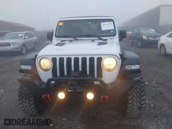 2022 Jeep Gladiator Rubicon z VIN 1C6JJTBG3NL111054, wystawiony jako IAAI lot #40793144 z przebiegiem 40 115 mil mil oraz . Historia ofert i sprzedaży dostępna na DreamBid. Obrazek 13.