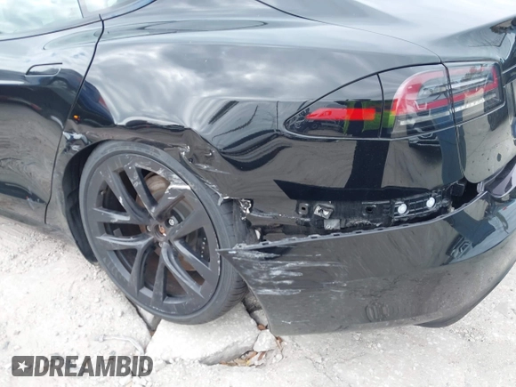 2023 Tesla Model S with VIN 5YJSA1E52PF500088, listed as a IAAI auction lot 41372918 with Not provided miles and . Bid and sale history available at DreamBid. Image 6.