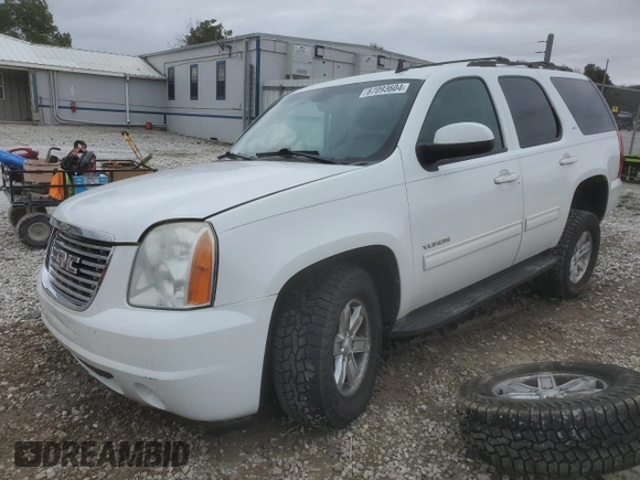 2012 GMC Yukon SLT with VIN 1GKS2CE09CR122728, listed as a Copart auction lot 87093604 with 124,739 mi miles and Salvage Title. Bid and sale history available at carsss.com. Image 1.
