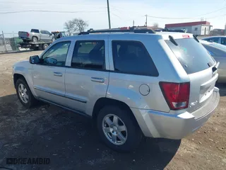 2010 Jeep Grand Cherokee Laredo with VIN 1J4PR4GK5AC161442, listed as a IAAI auction lot 41939994 with 137,376 mi miles. Bid and sale history available at carsss.com. Image 3.