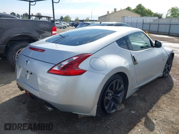 2018 Nissan 370Z Sport with VIN JN1AZ4EH7JM572602, listed as a IAAI auction lot 41902662 with 76,262 mi miles and . Bid and sale history available at DreamBid. Image 4.