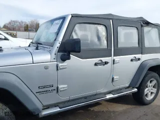 2010 Jeep Wrangler Unlimited Sport with VIN 1J4BA3H10AL112599, listed as a IAAI auction lot 41739263 with 156,301 mi miles. Bid and sale history available at carsss.com. Image 6.