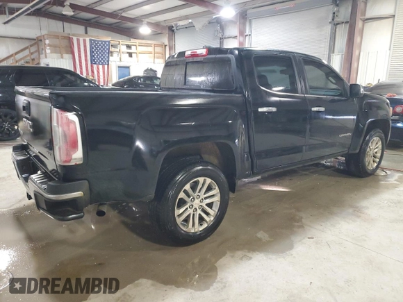 2016 GMC Canyon 2WD SLT with VIN 1GTG5DE39G1100516, listed as a Copart auction lot 87648455 with 243,815 mi miles and Salvage Title. Bid and sale history available at carsss.com. Image 3.