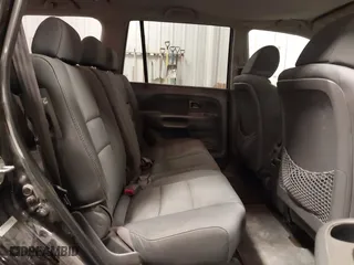 2007 Honda Pilot LX with VIN 5FNYF18117B009290, listed as a IAAI auction lot 41205310 with 150,081 mi miles. Bid and sale history available at carsss.com. Image 8.