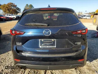 2023 Mazda CX-5 Signature with VIN JM3KFBXY1P0122544, listed as a Copart auction lot 83712034 with 27,032 mi miles and Salvage Title. Bid and sale history available at DreamBid. Image 6.
