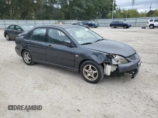 2004 Mitsubishi Lancer OZ-Rally with VIN JA3AJ86E04U029594, listed as a Copart auction lot 73143284 with 71,623 mi miles and Clean Title. Bid and sale history available at carsss.com. Image 4.
