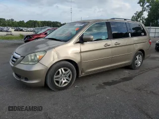2005 Honda Odyssey EX-L with VIN 5FNRL38795B010214, listed as a Copart auction lot 63239965 with 127,927 mi miles and Salvage title. Bid and sale history available at DreamBid. Image 1.