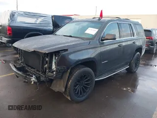 2015 GMC Yukon SLT with VIN 1GKS2BKC7FR110106, listed as a IAAI auction lot 41702260 with 108,679 mi miles. Bid and sale history available at carsss.com. Image 2.